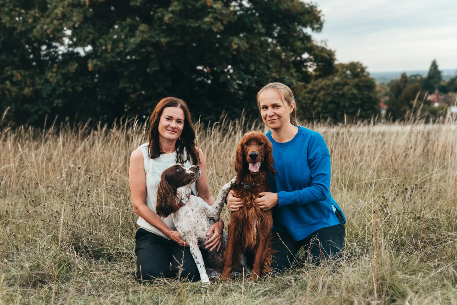 Burpham Vets team with their dogs in Guildford
