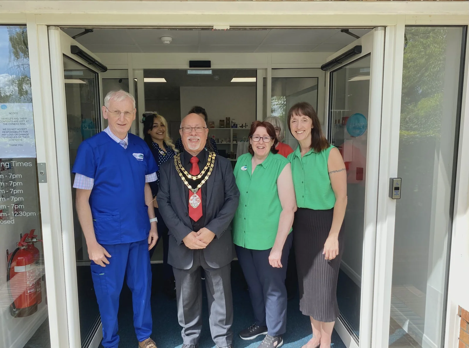 Team and visitors at the entrance to Royston Veterinary Centre in Flint Cross