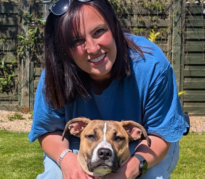 Naismith Vets registered veterinary nurse Cassie Innes with a dog in Glasgow