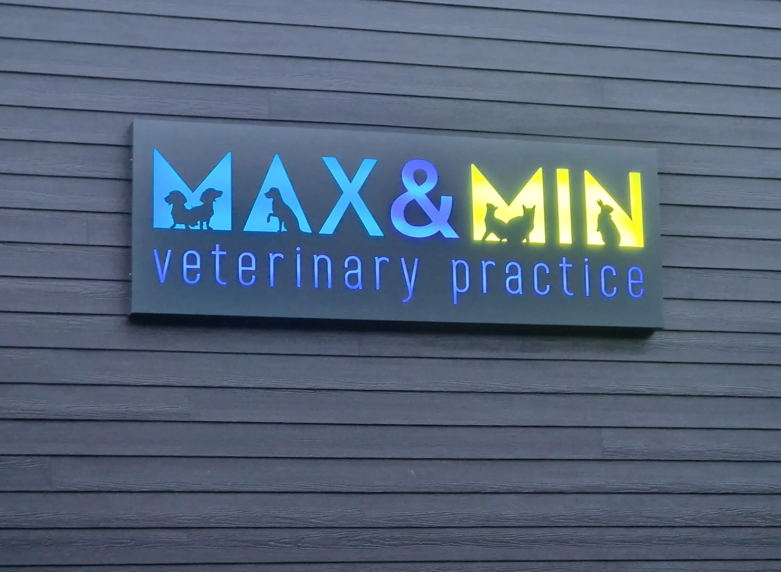 Max and Min Veterinary Practice sign on the clinic building in Hertford