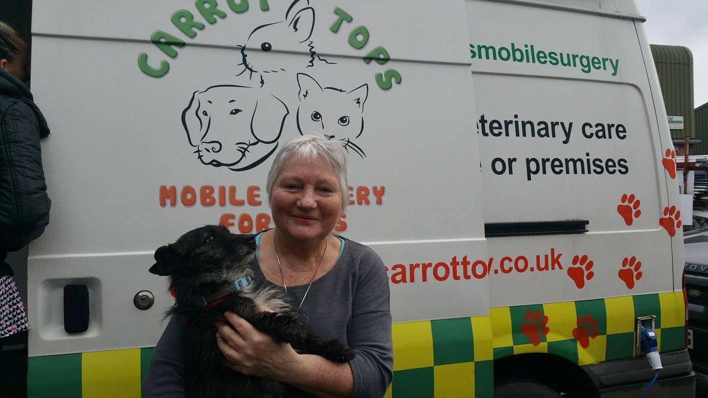 Carrot Tops Vets mobile surgery vehicle with a member of the veterinary team