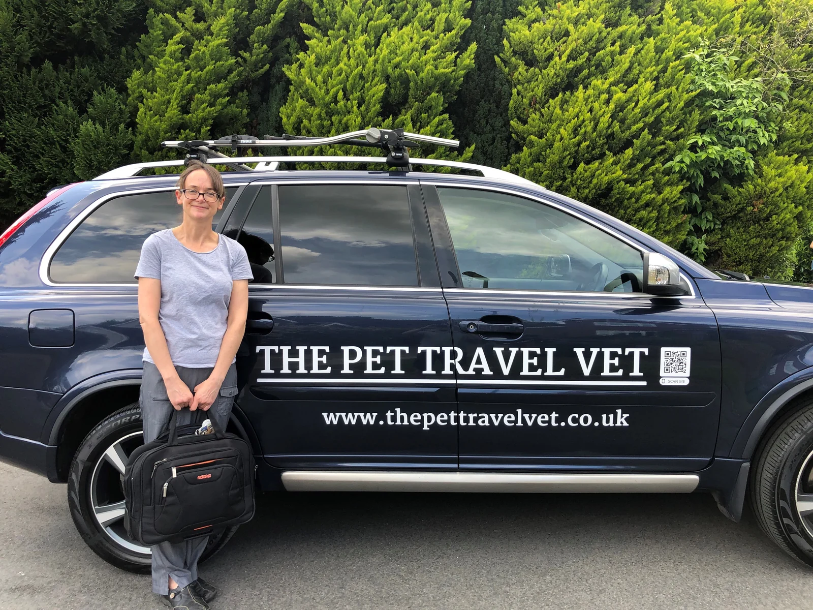 Vicky Hall beside The Pet Travel Vet’s branded mobile service vehicle